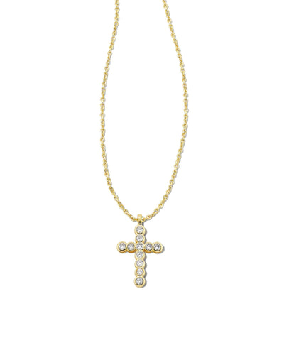 Kendra Scott Crystal Cross Pendant Necklace Gold closeup on white background.