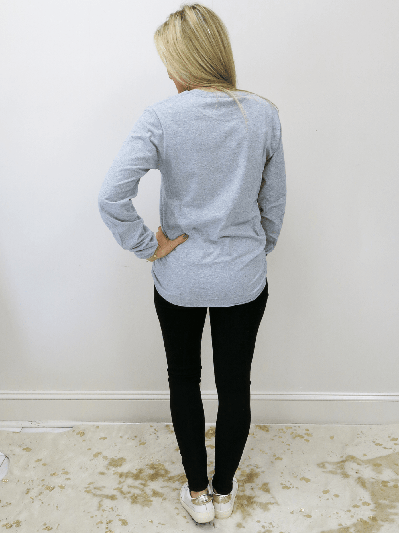 Plain grey back with grey jeans.