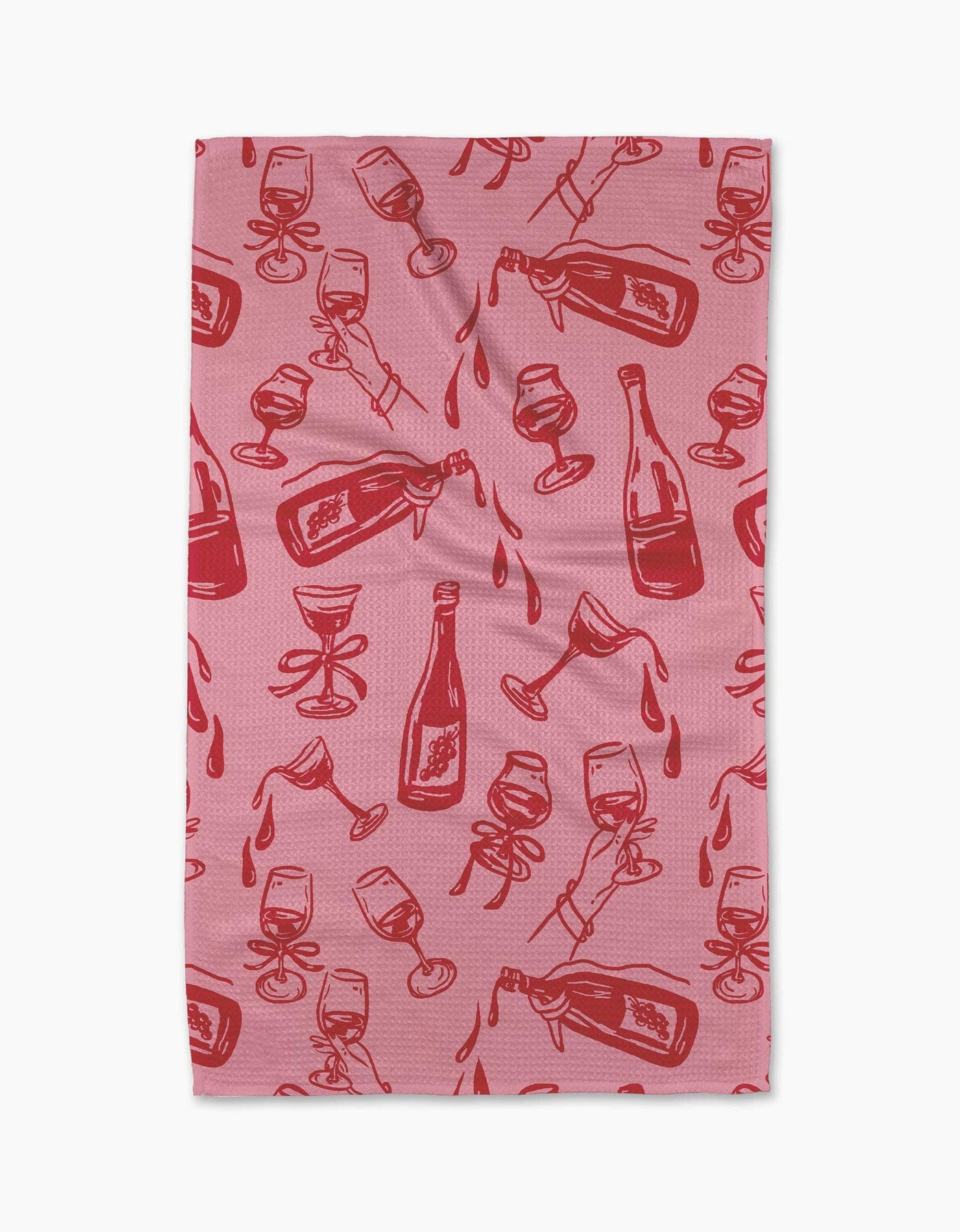Pink tea towel with red wine bottle and glass pattern on a white background