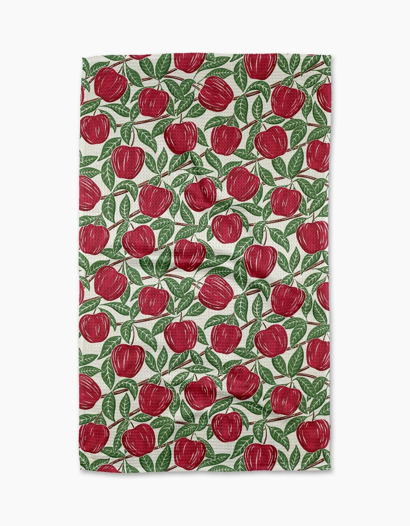 Tea towel with red apple pattern on a white background