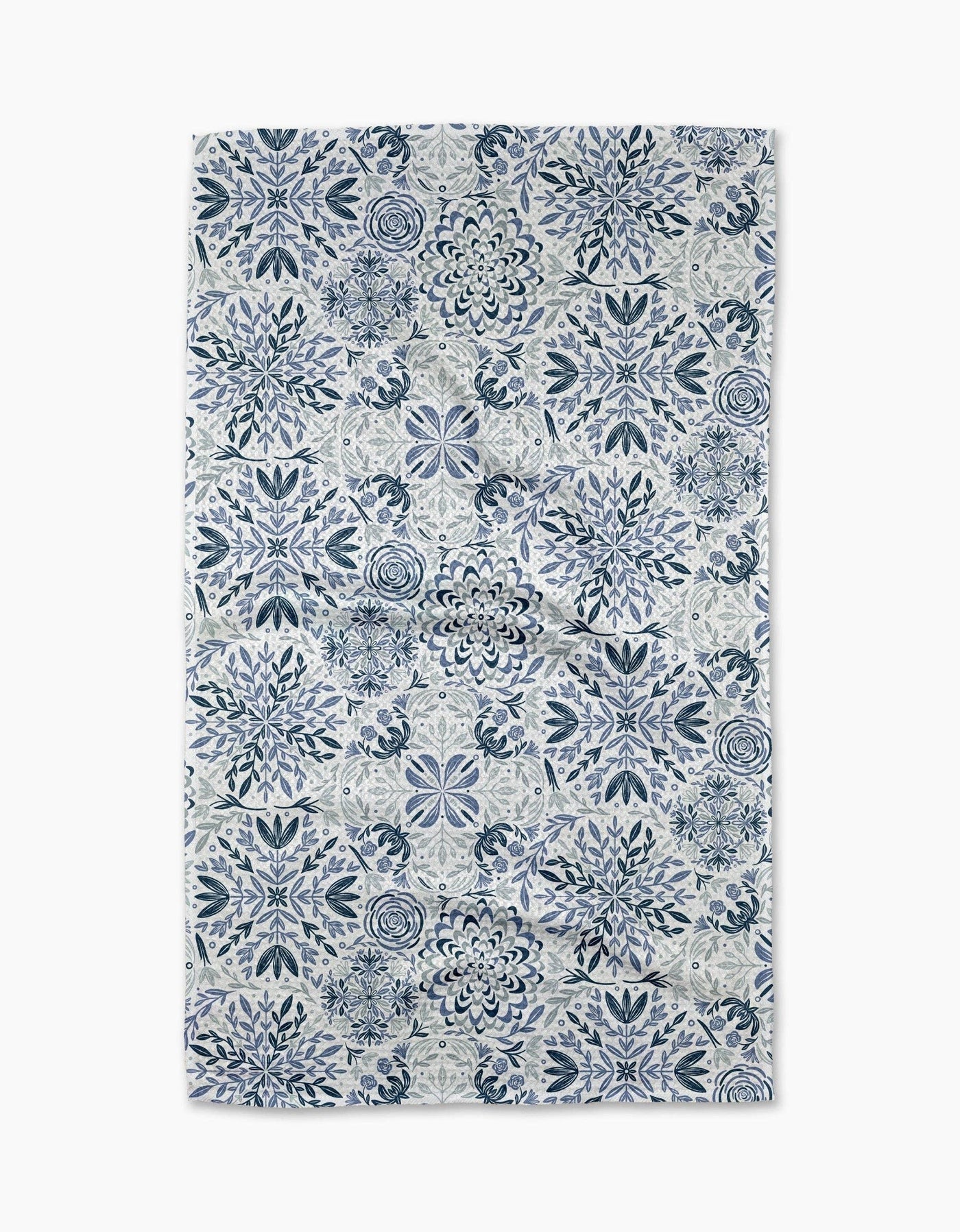 Decorative tea towel with blue and white floral pattern on a white background