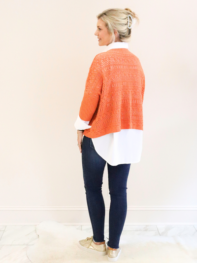 Reina Crochet 3/4 Sleeve Sweater back view with white collar shirt and jeans.