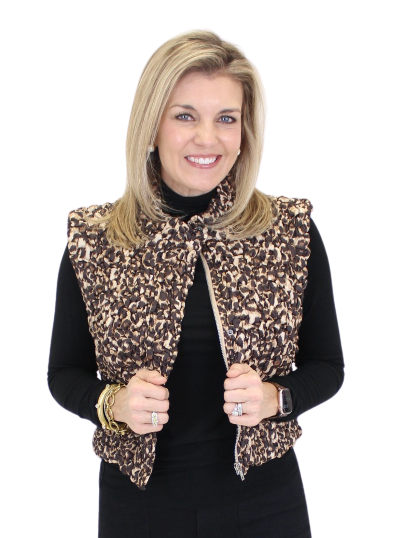 Woman wearing a leopard print vest over a black outfit on a white background