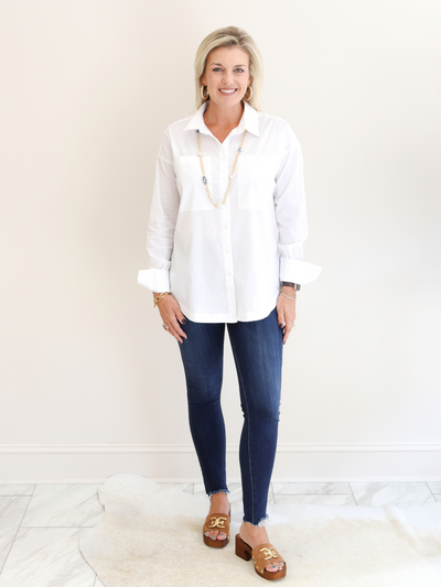 White Poplin Button Down front view with jeans.