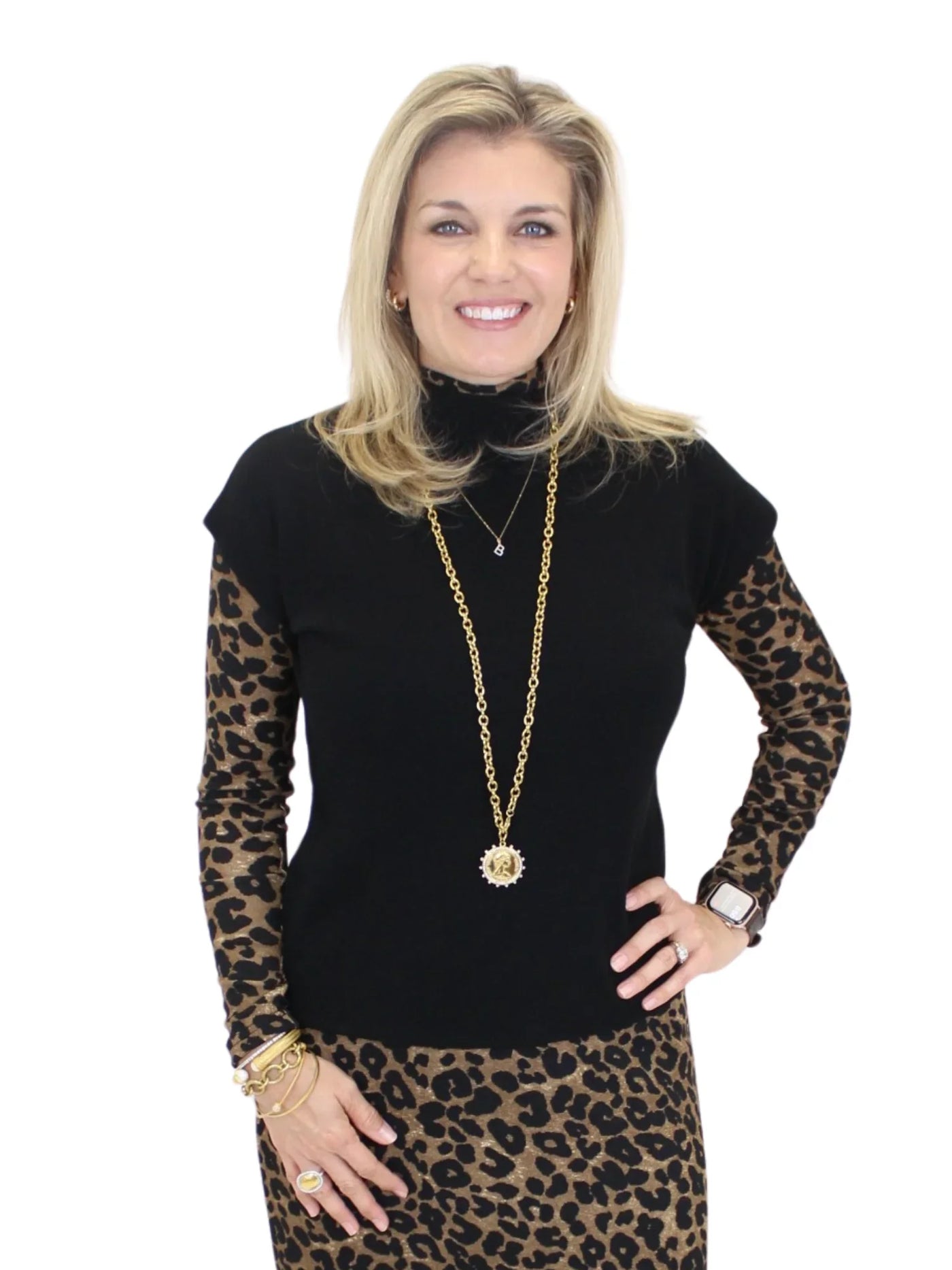 Molly Bracken Short Sleeve Mock Neck Sweater - Black front view over a leopard top.