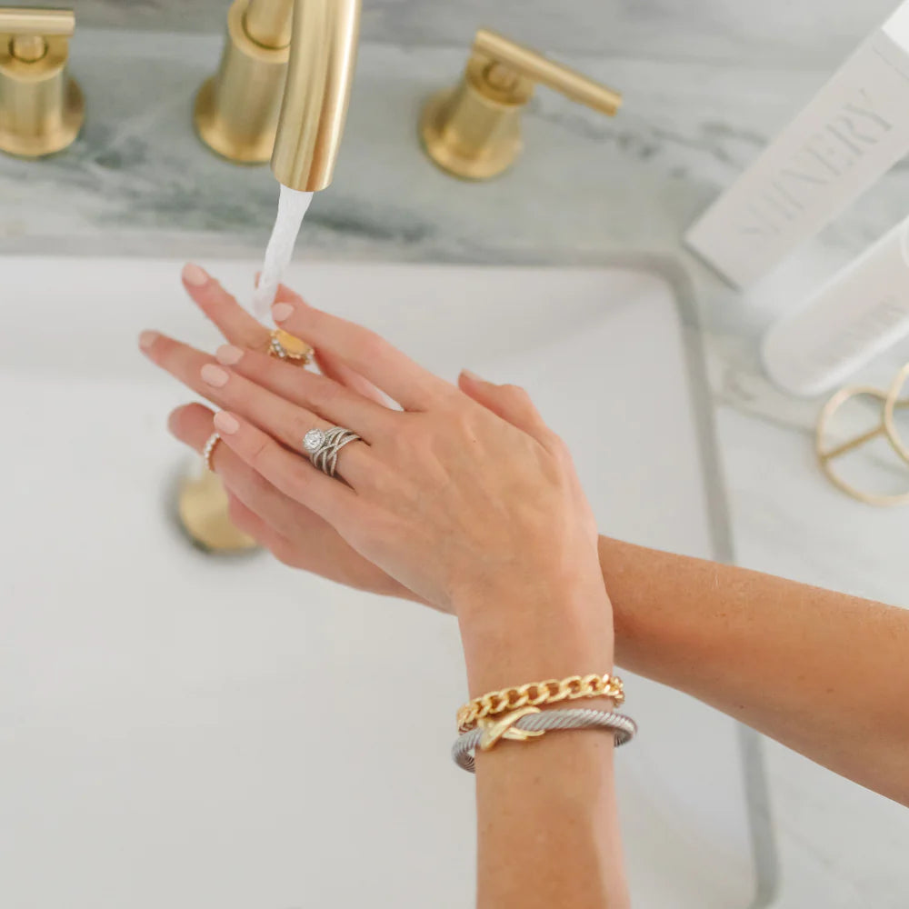 Woman washing hands with Shinery Radiance Wash