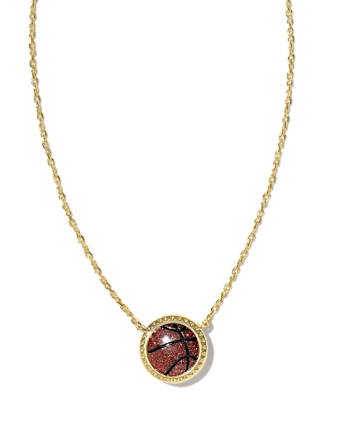 Kendra Scott Basketball Pendant Necklace in Gold on white background close up.