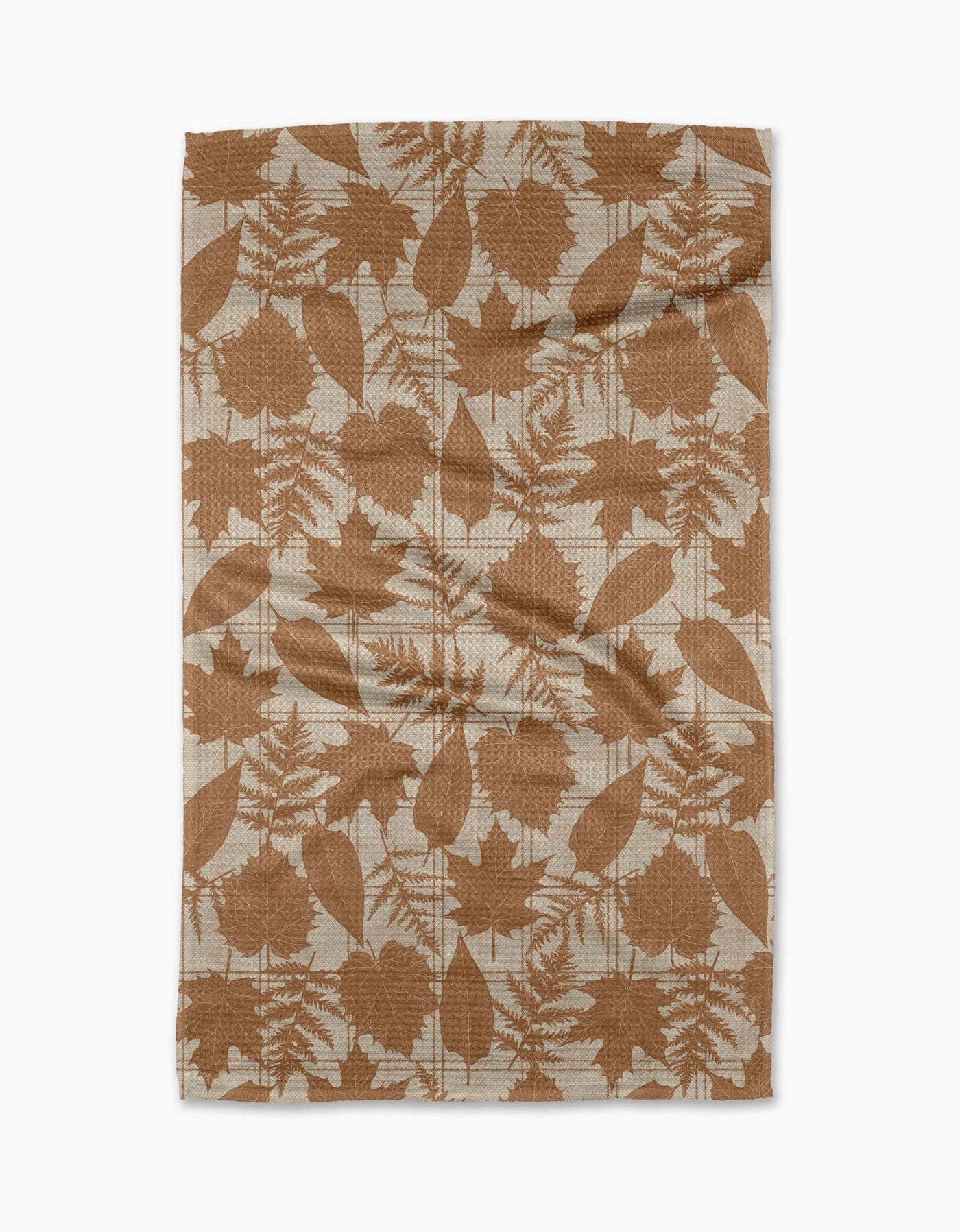 Tea towel with brown leaf pattern on a white background