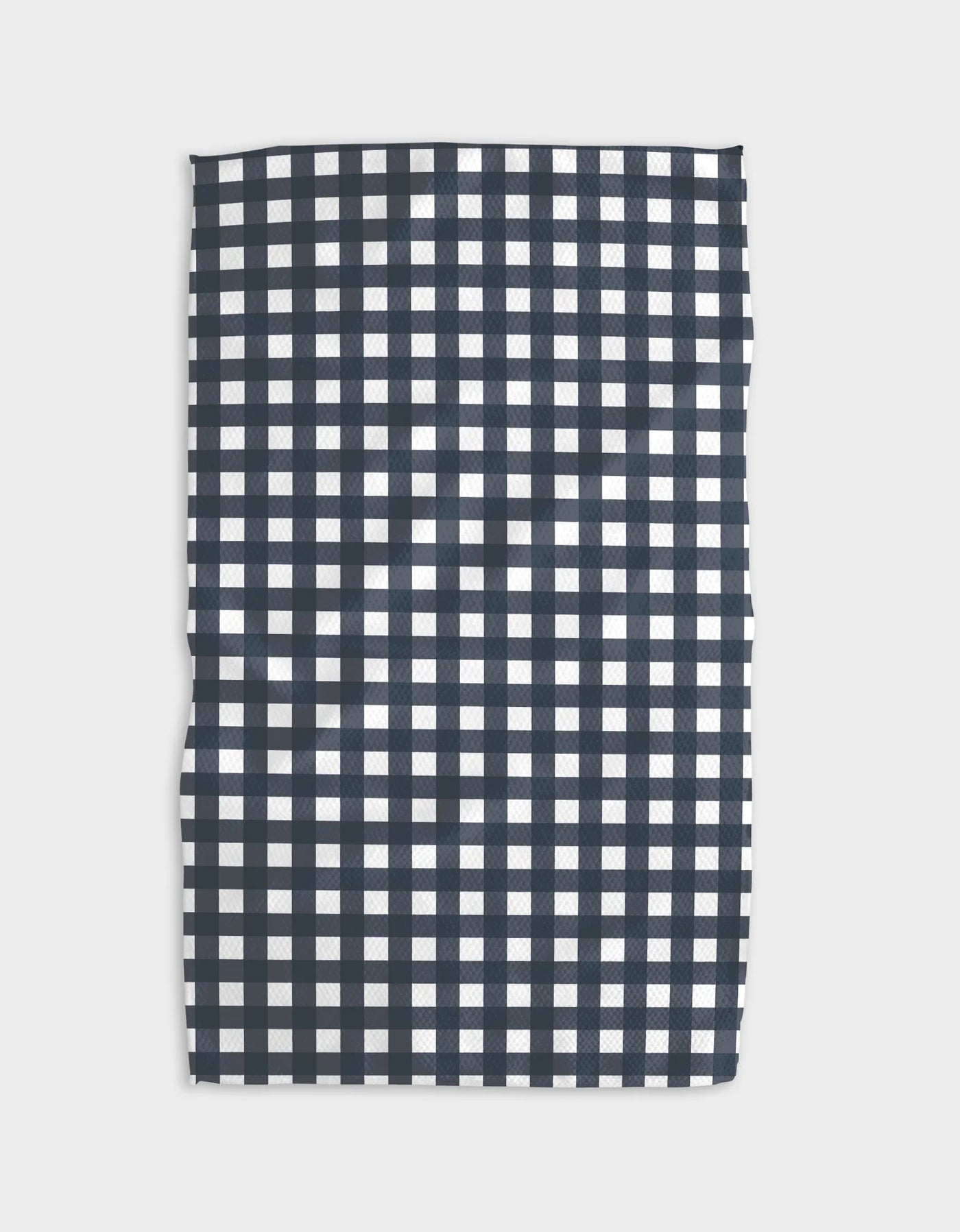 Navy and white checkered tea towel on a light gray background