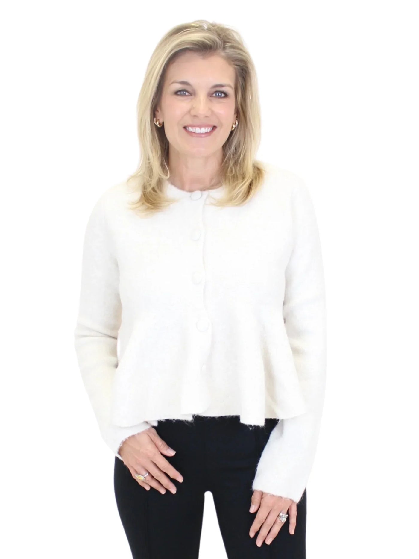 Woman wearing a white blouse and black pants on a white background