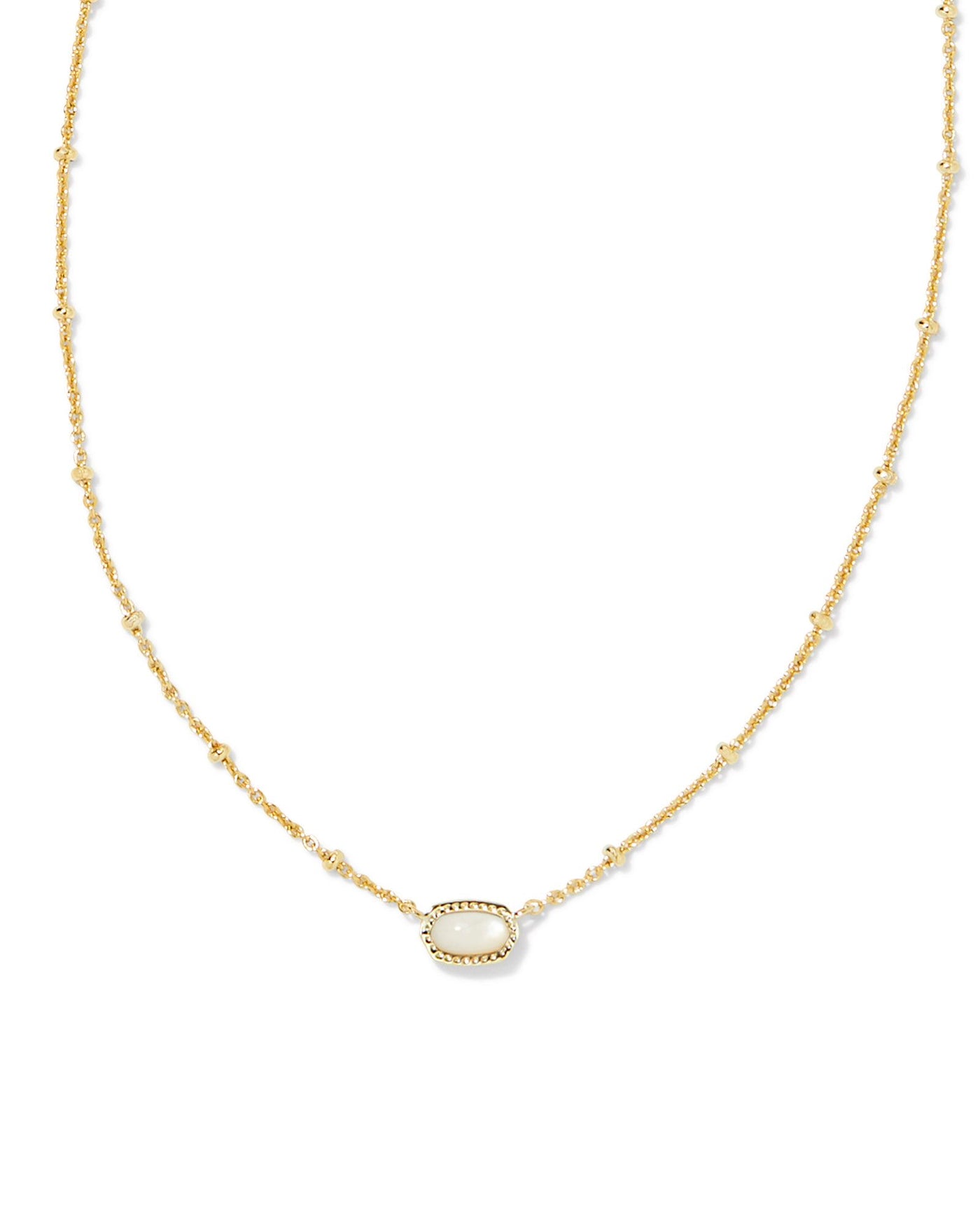 Kendra Scott Mini Elisa Satellite Necklace in Gold Ivory Mother of Pearl on white background close up.