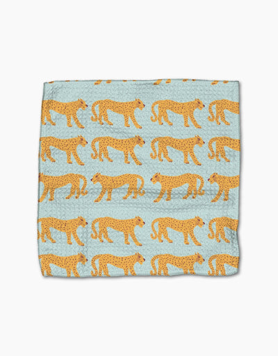 Light green dishcloth with cheetahs on white background