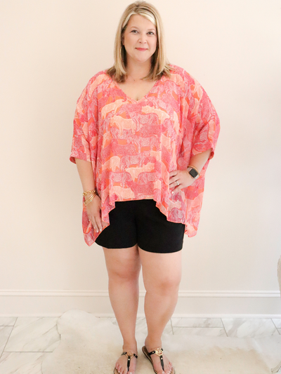 Molly Bracken Pink Savannah Top front view of XL top with black shorts.