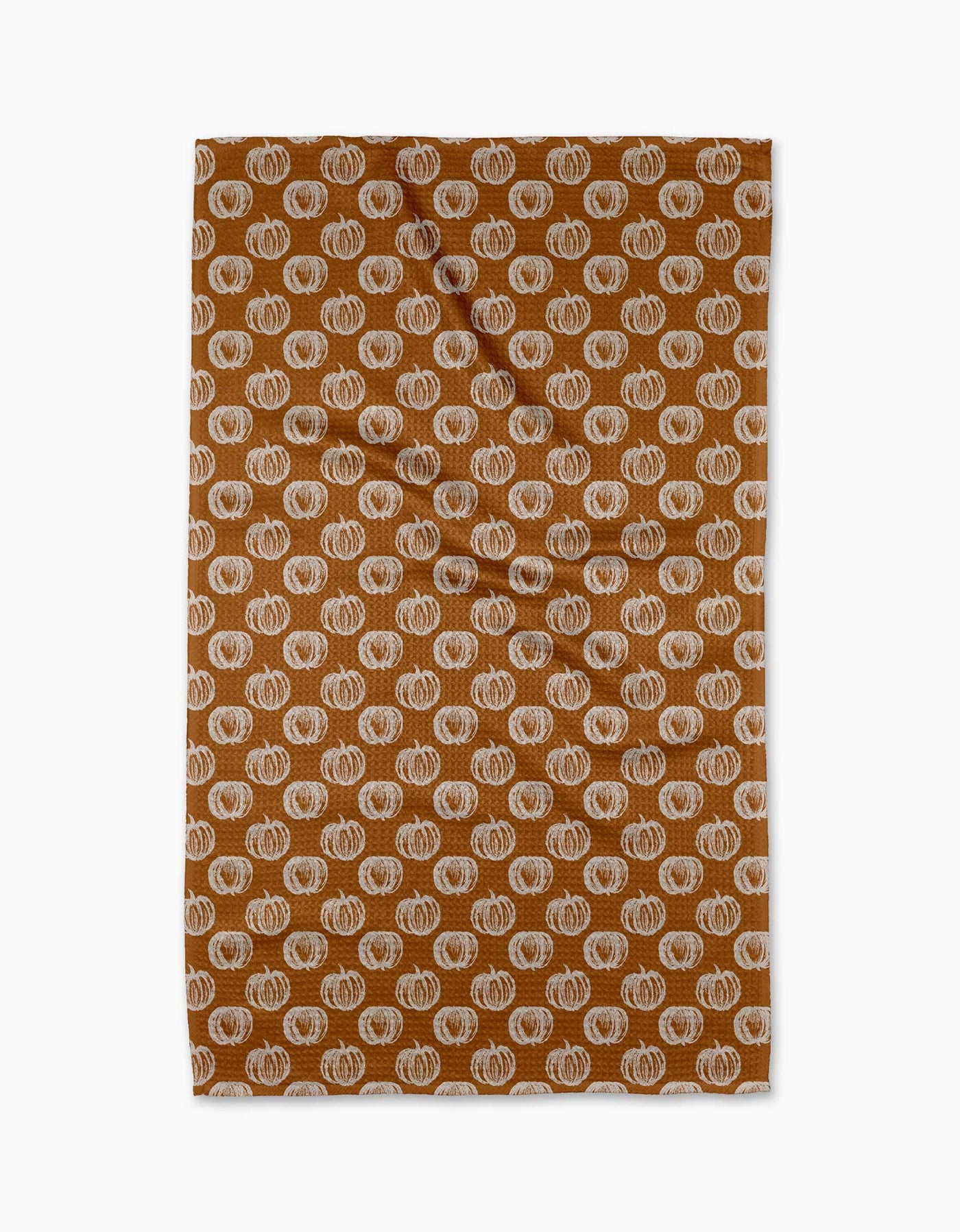 Rusty orange tea towel with pumpkin print on white background