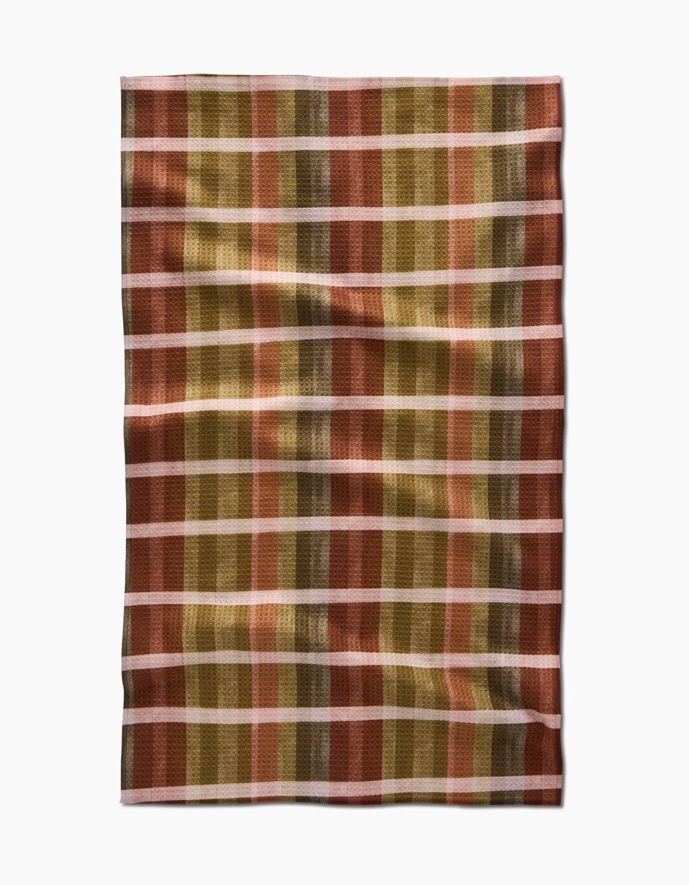 Plaid tea towel with autumnal colors on white background