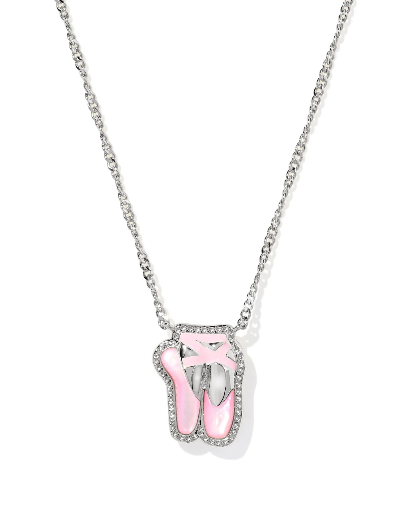 Silver necklace with a pink ballet slipper pendant on a white background, closeup.
