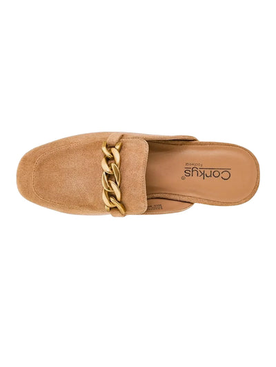 Tan suede slip on shoe with gold chain on white background, top.