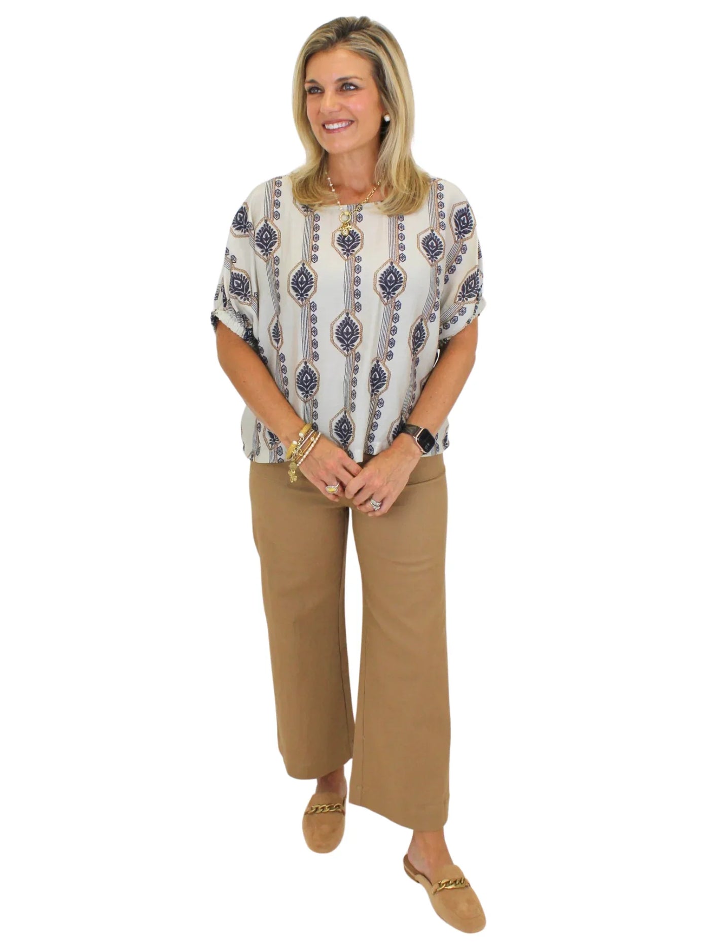 Tan cropped wide leg pants on model on white background, front.