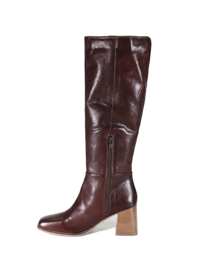 Brown leather knee high boot with block heel on white background, side view.