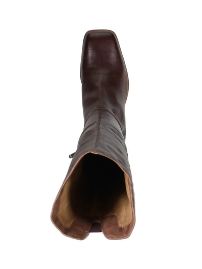 Brown knee high boot on white background, aerial view.