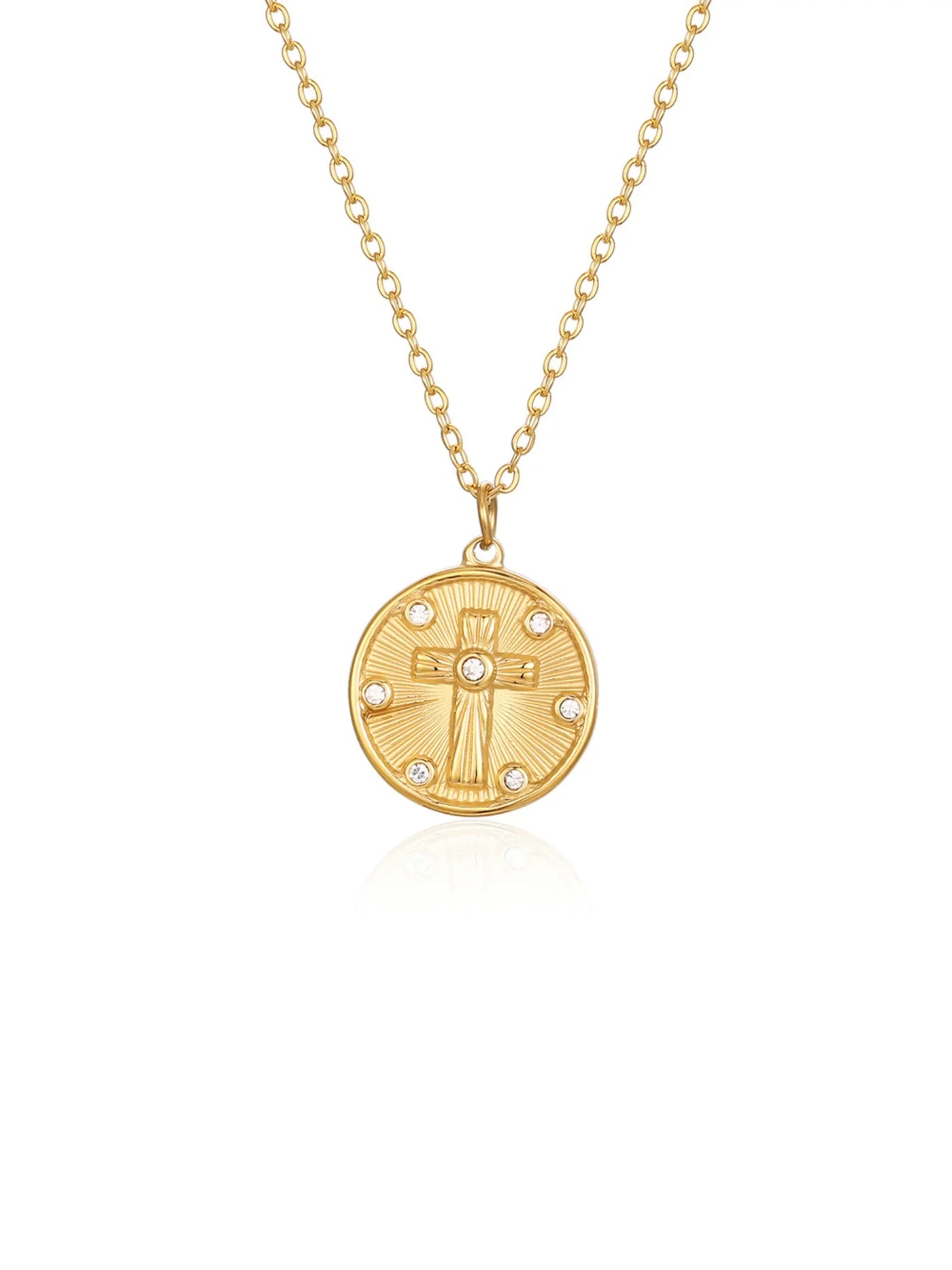 Gold necklace with a round pendant featuring a cross design on a white background.