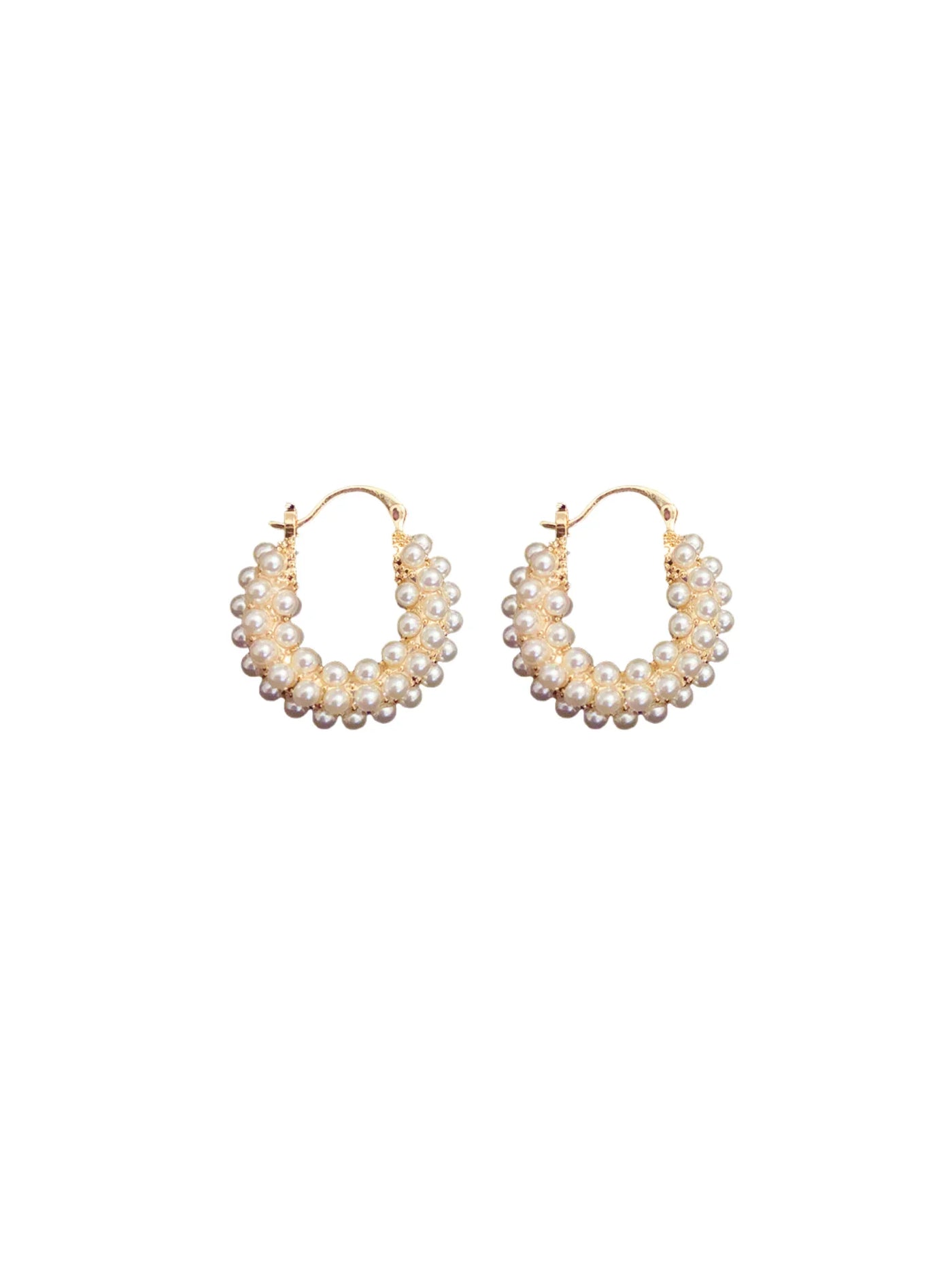 Pair of pearl pave hoop earrings on a white background.