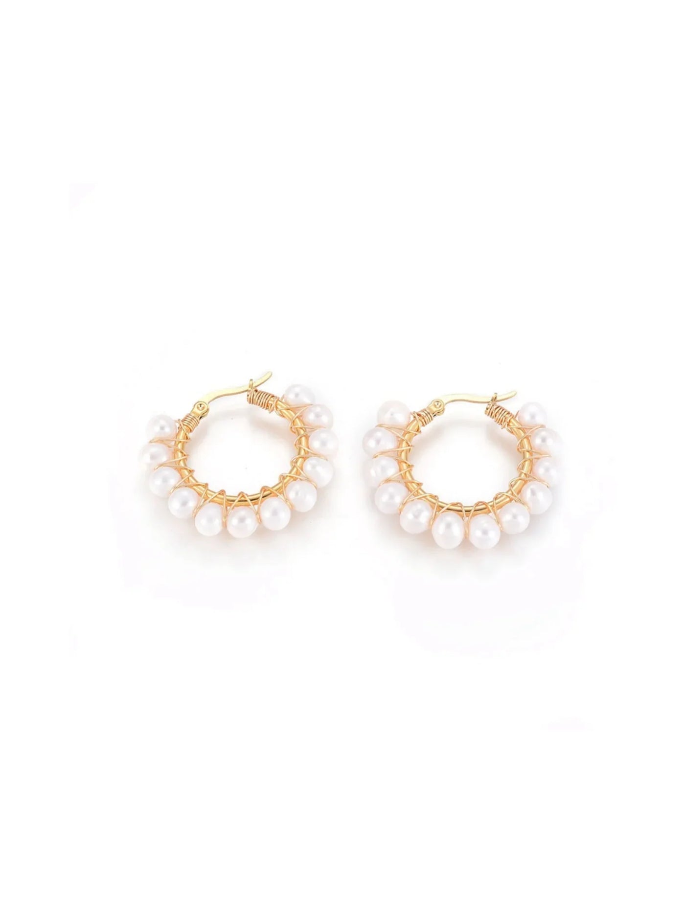 Gold hoop earrings with pearl accents on a white background.
