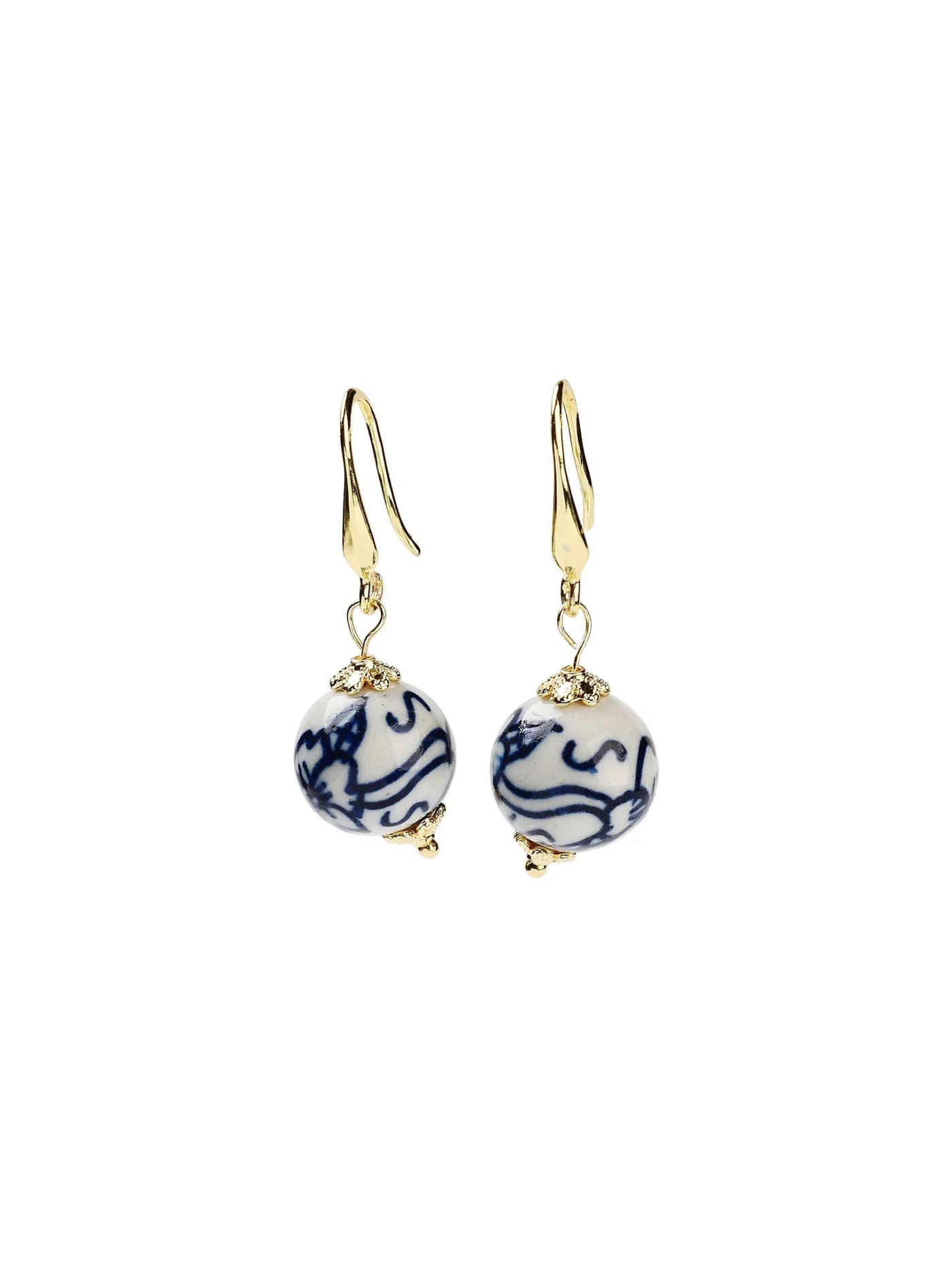 Pair of gold earrings with blue and white round beads on a white background.