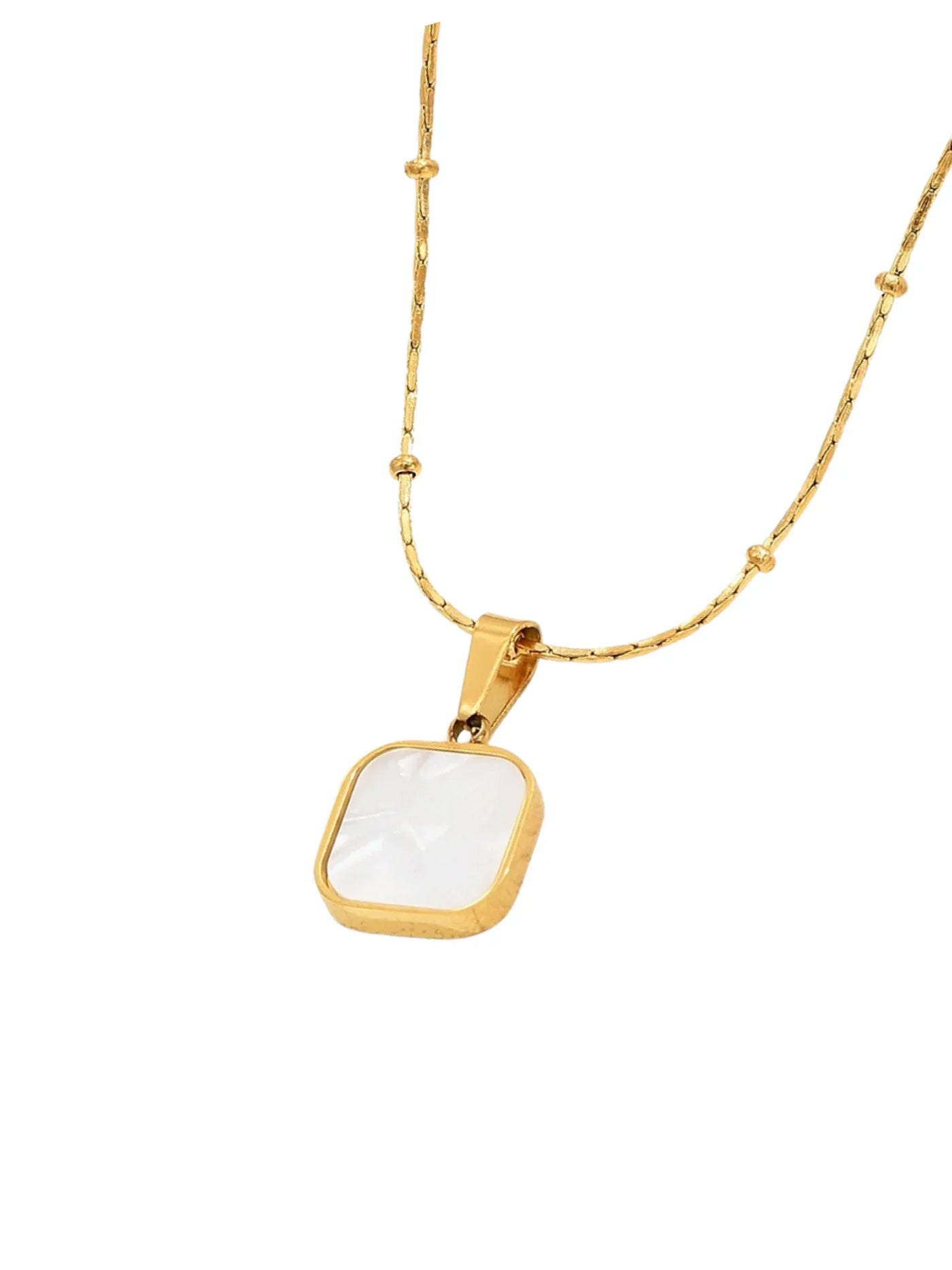 Gold necklace with a white square pendant on a white background