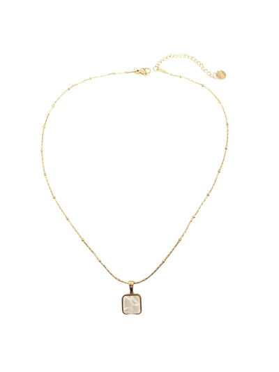 Gold necklace with a square pendant on a white background.