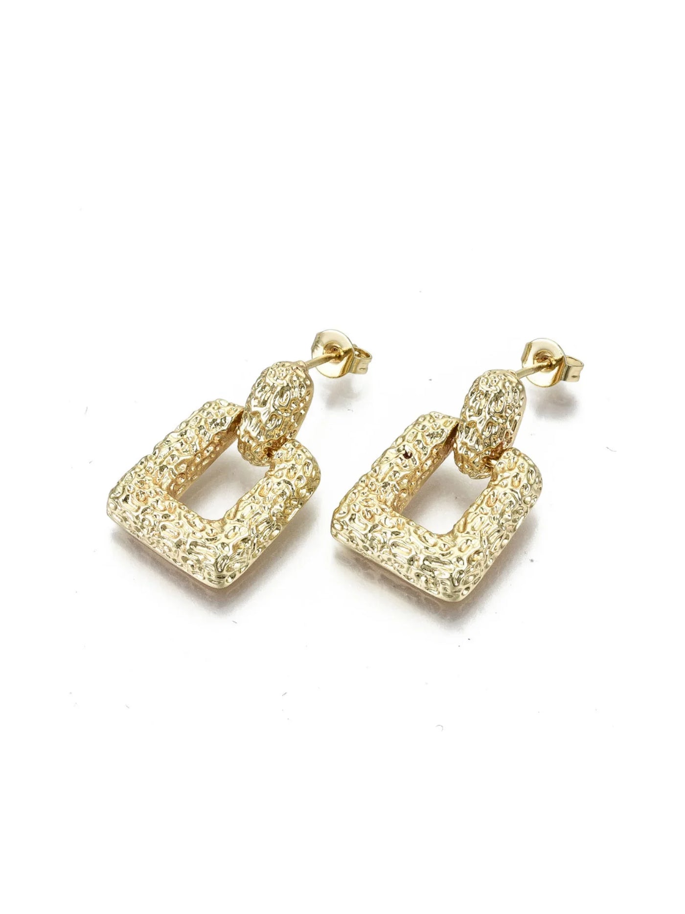 Gold earrings with textured design on a white background.