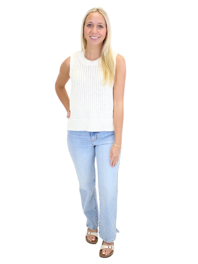 Ivory crochet tank top on model, front.