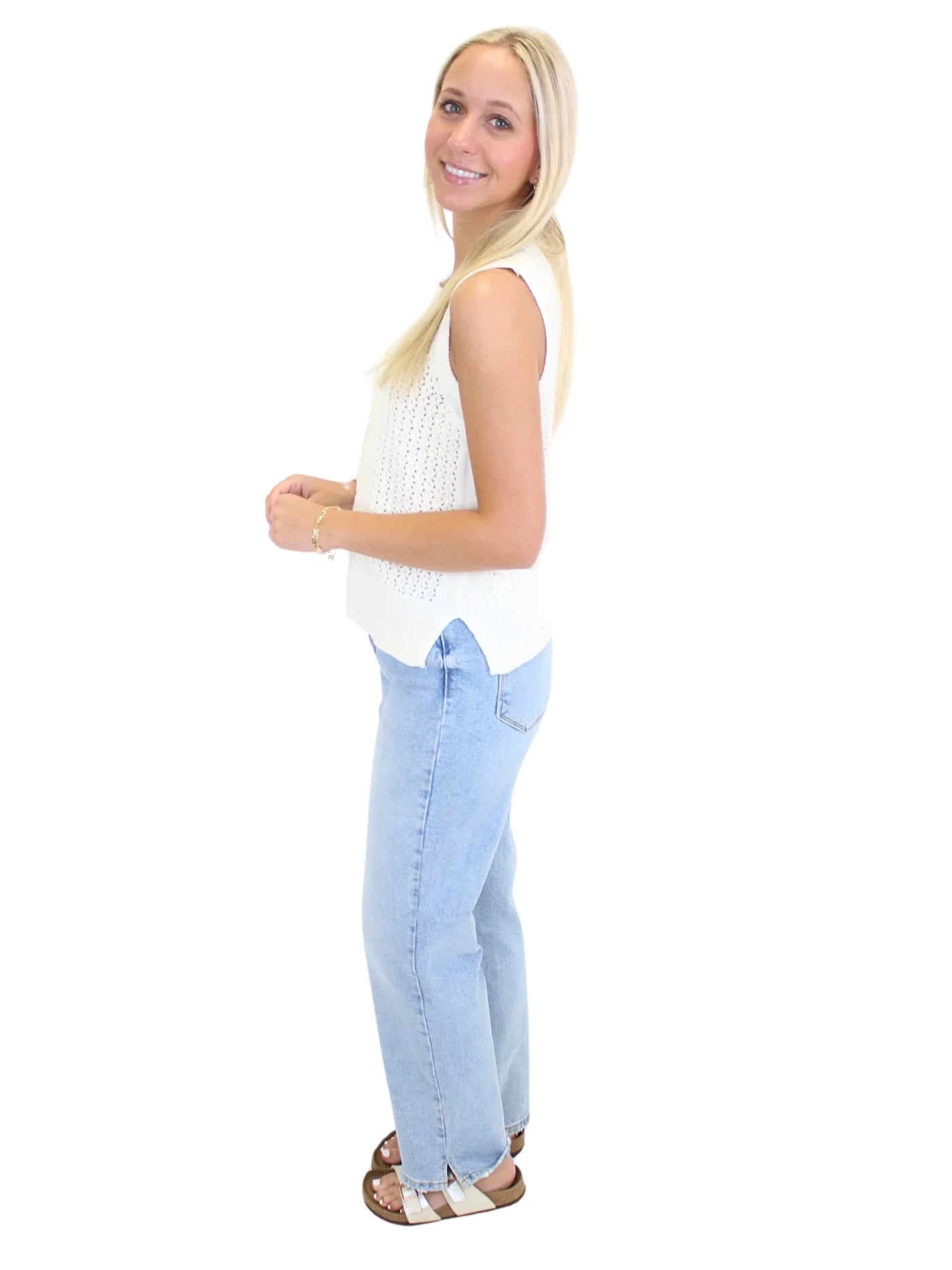 Light wash braided trim jean jacket on model, side.