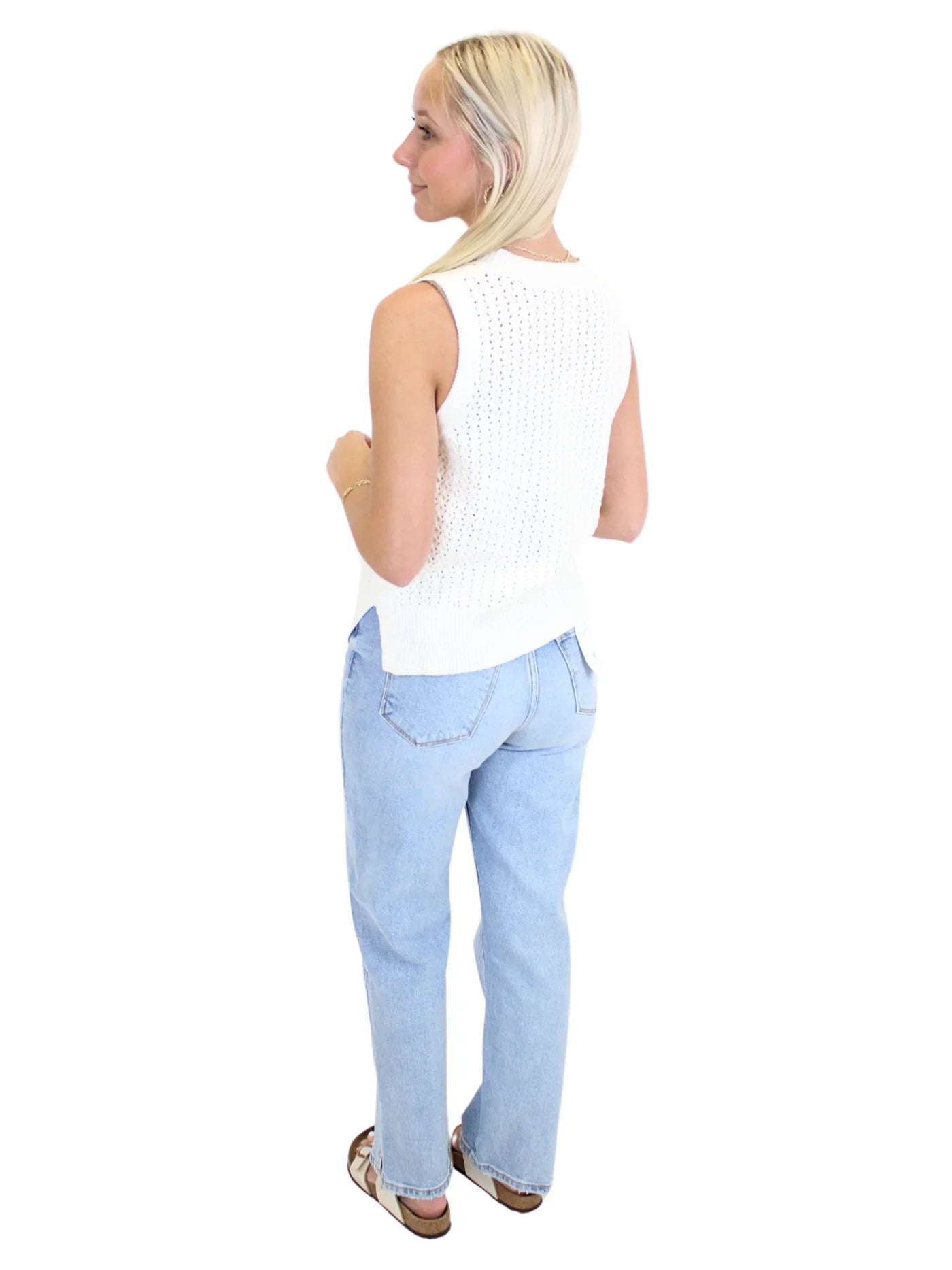 Light wash braided trim jean jacket on model, back.