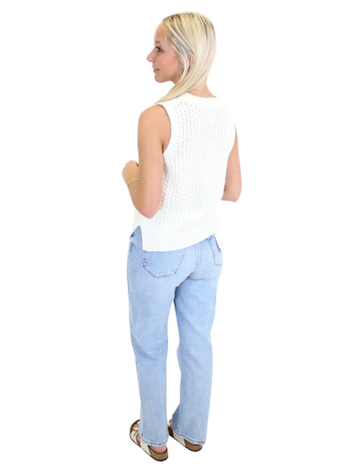 Light wash braided trim jean jacket on model, back.