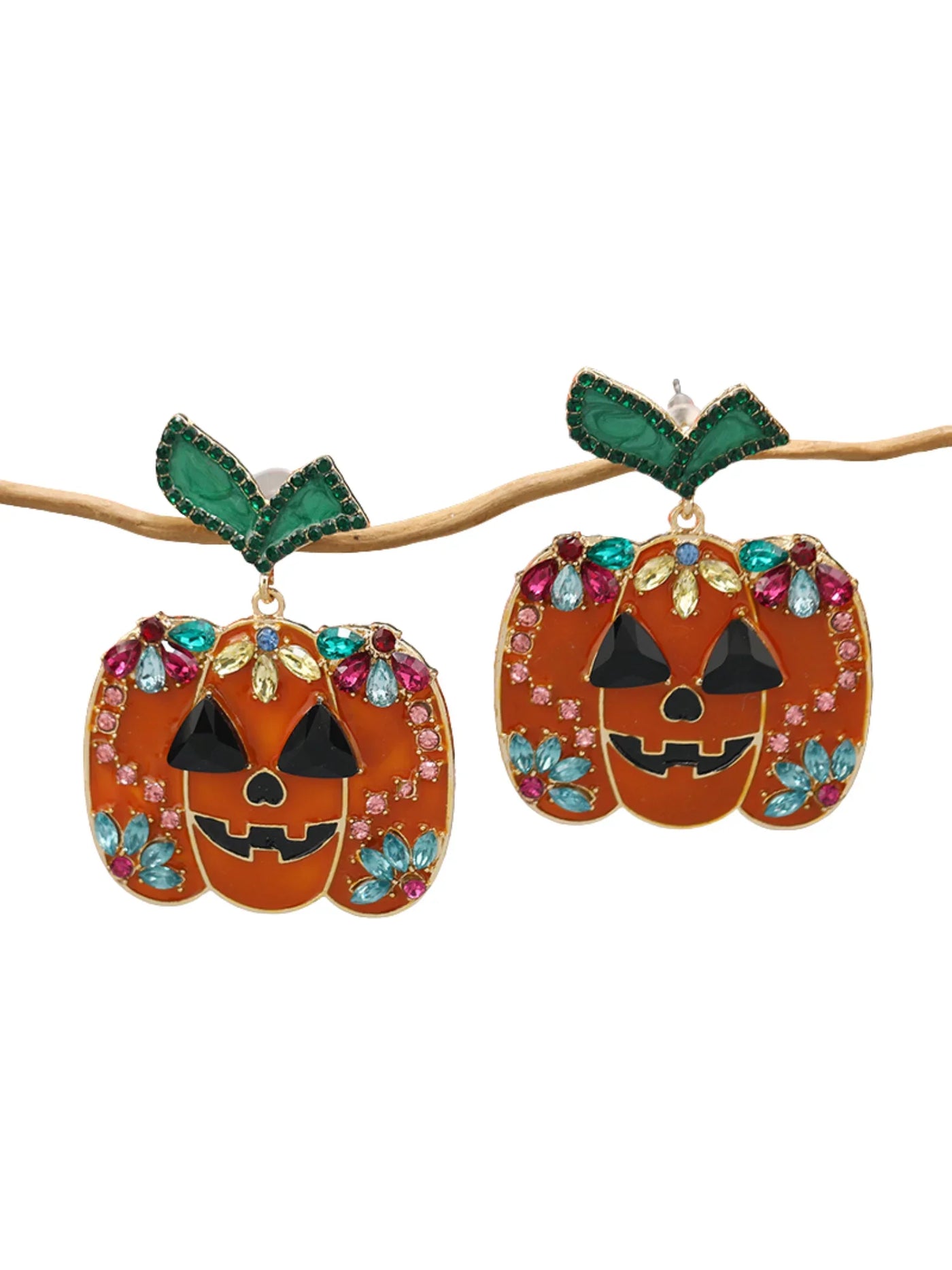 Pumpkin-shaped earrings with colorful gemstones on a white background.