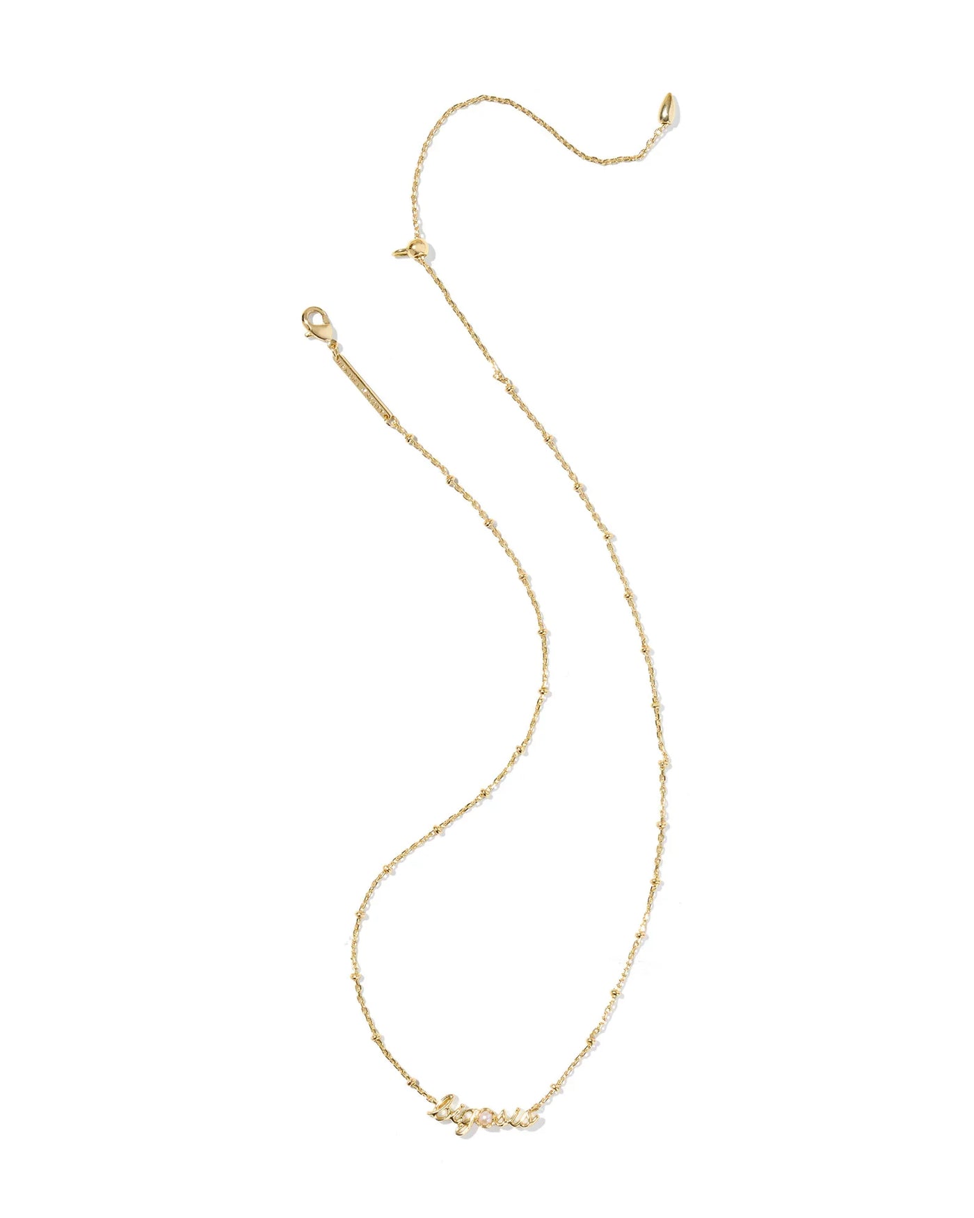 Gold necklace with big sis pendant and pearl on a white background.