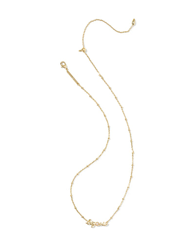 Gold necklace with big sis pendant and pearl on a white background.