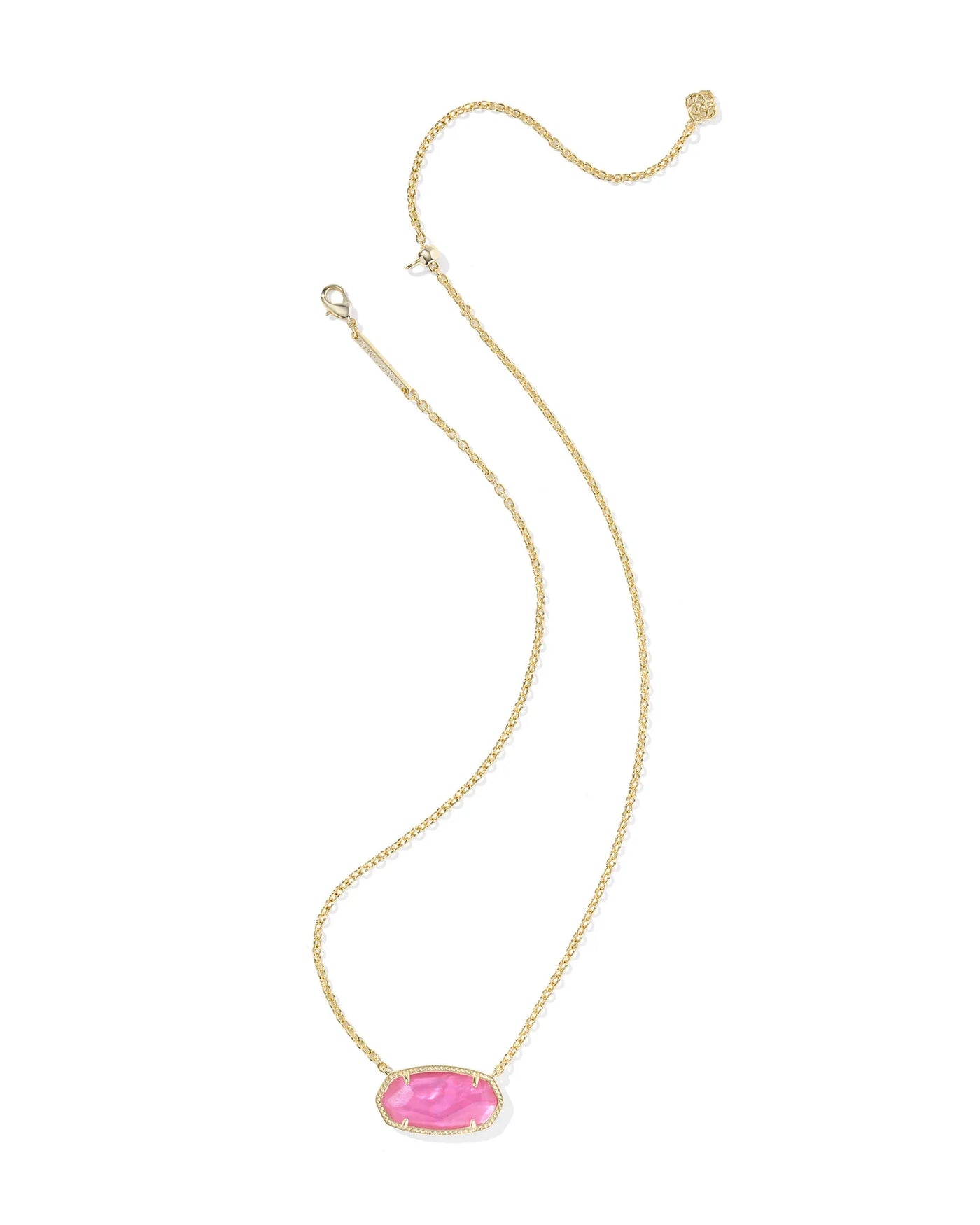 Gold necklace with a pink pendant on a white background.