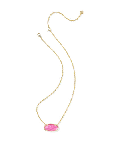 Gold necklace with a pink pendant on a white background.