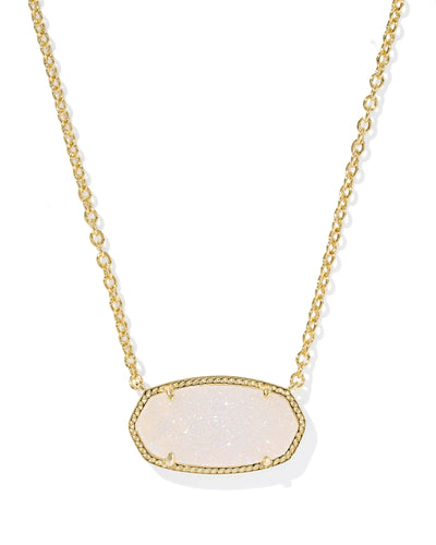 Gold necklace with a large iridescent drusy pendant against a white background, closeup.