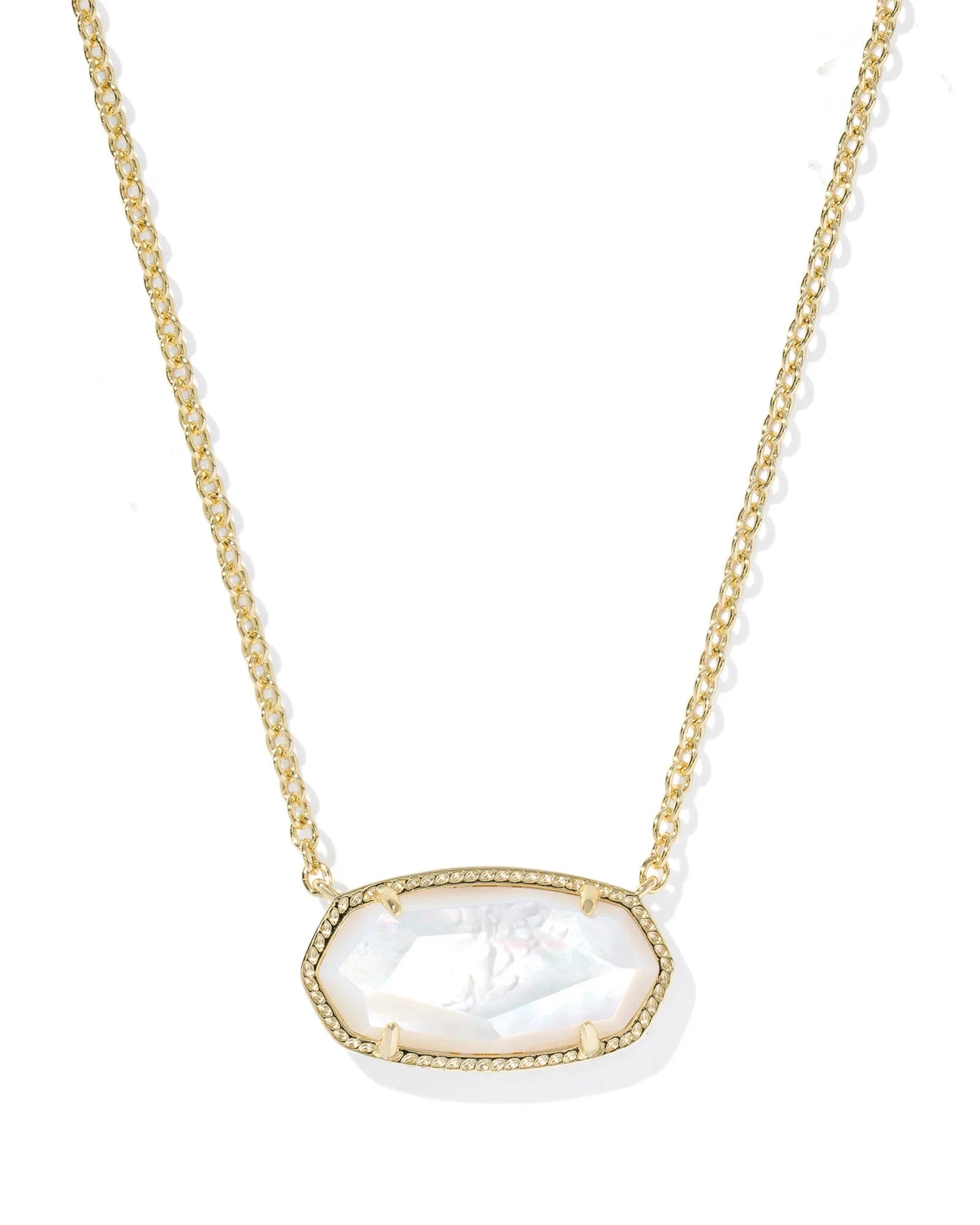 Gold necklace with a large mother of pearl pendant on a white background, closeup.