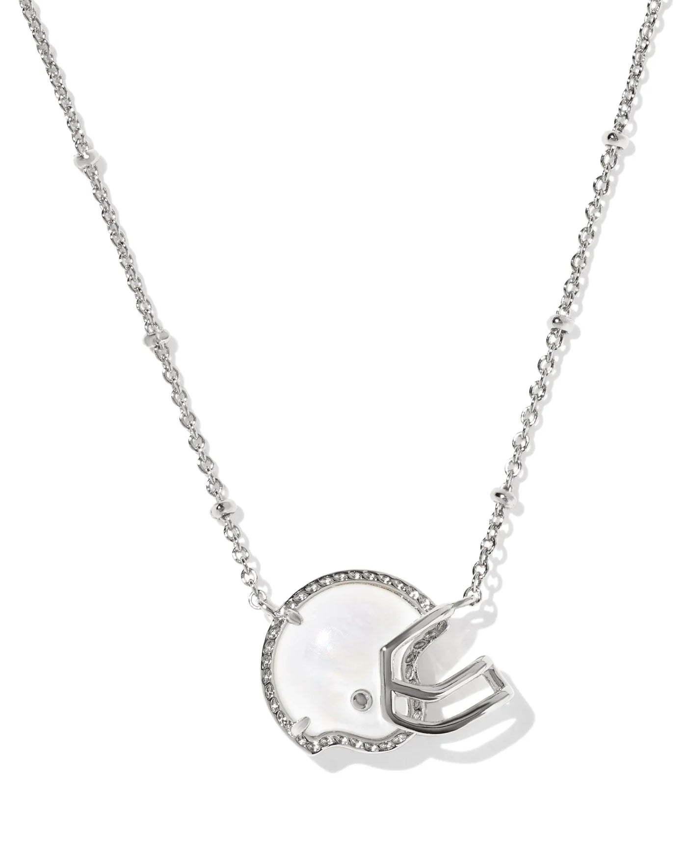 Silver necklace with a football helmet pendant on a white background, closeup.