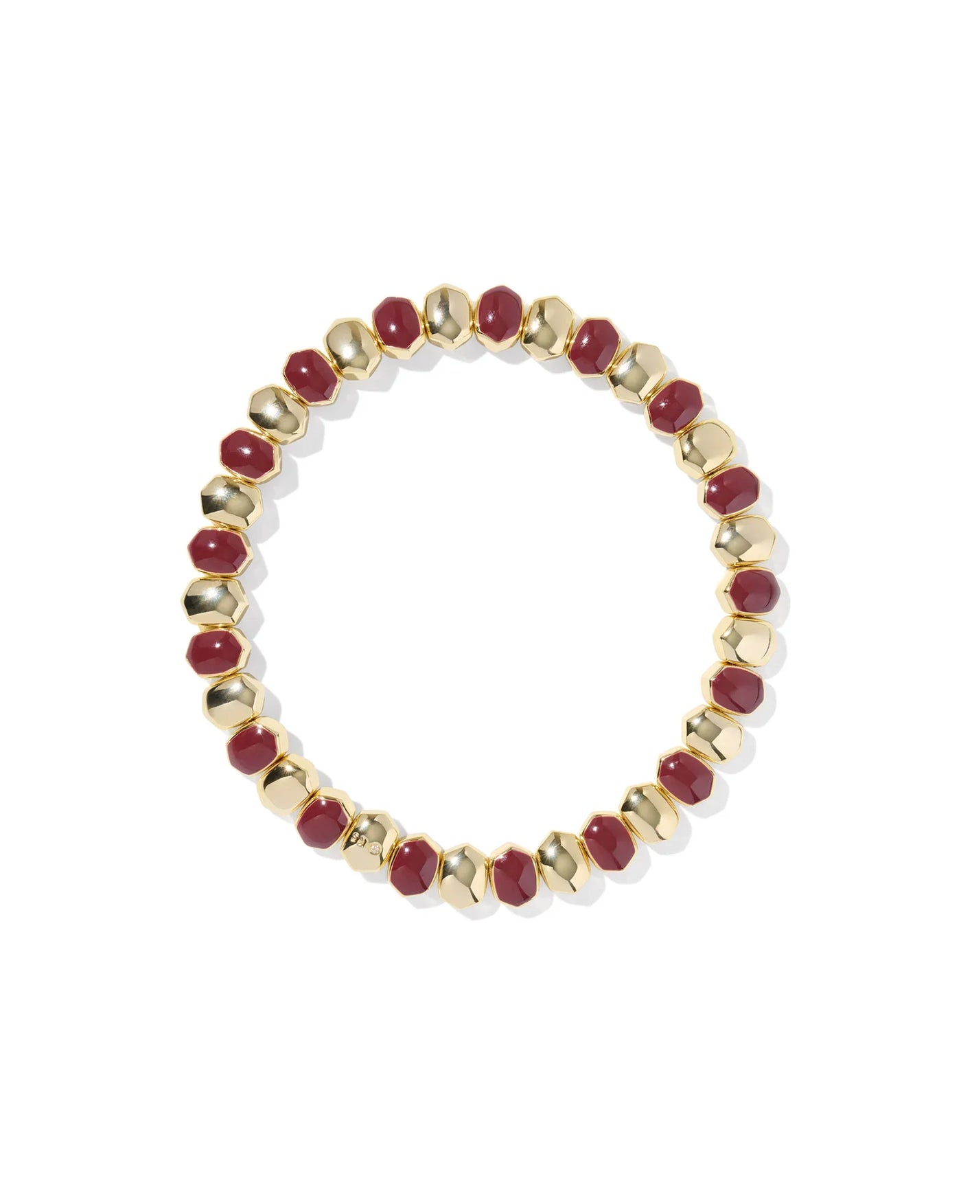 Bracelet with gold and red beads on a white background.