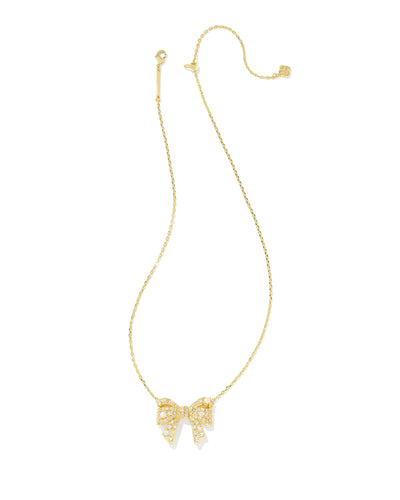 Gold bow-shaped necklace on a white background.