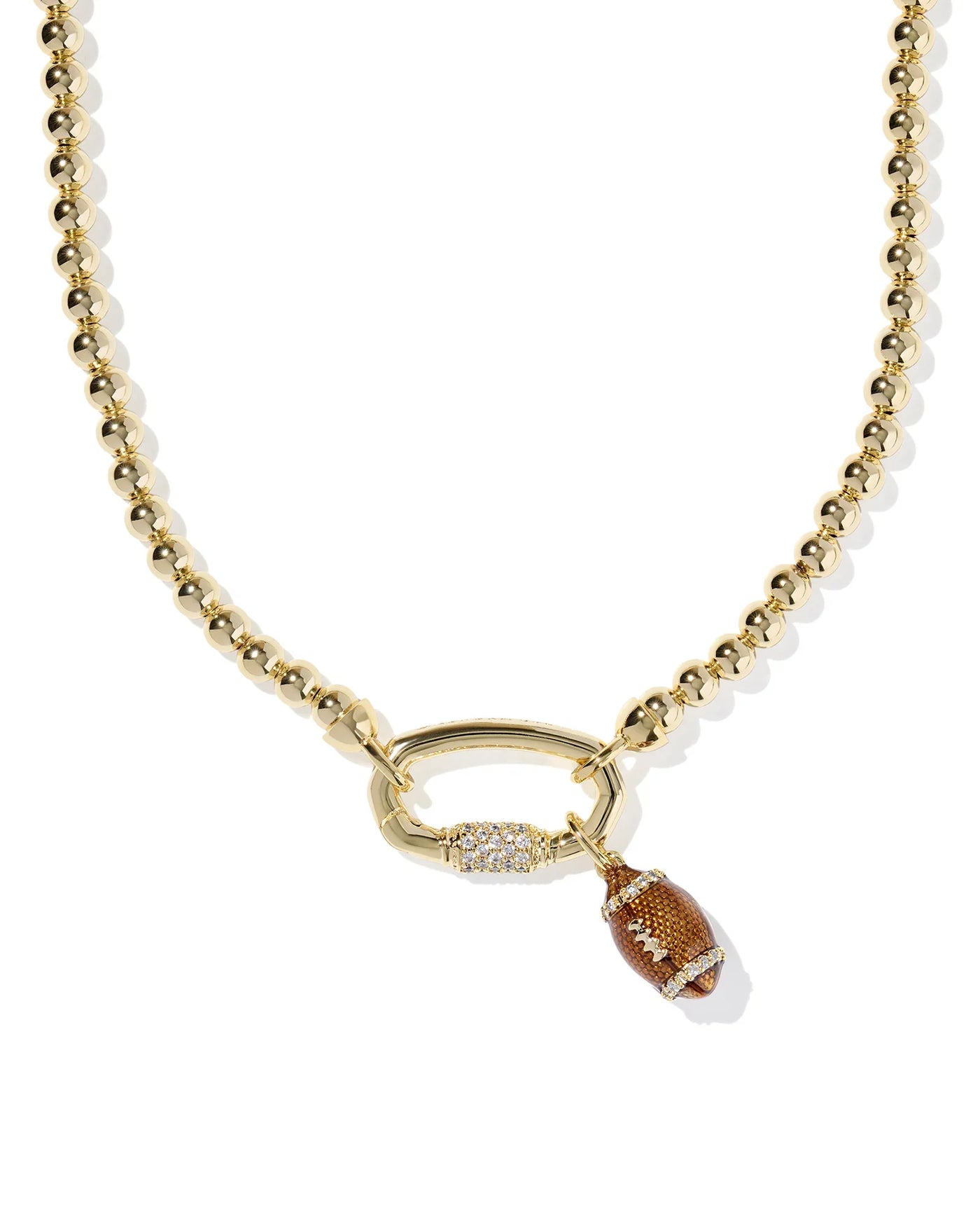 Gold beaded necklace with a football pendant on a white background, closeup.