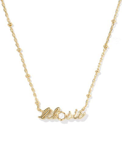 Gold necklace with "lil sis" pendant and pearl on white background, closeup.