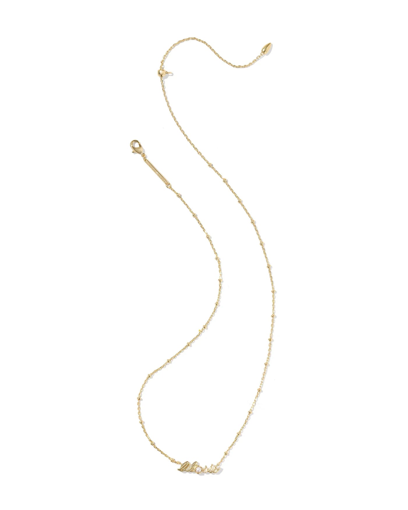 Gold necklace with lil sis pendant and pearl on a white background.