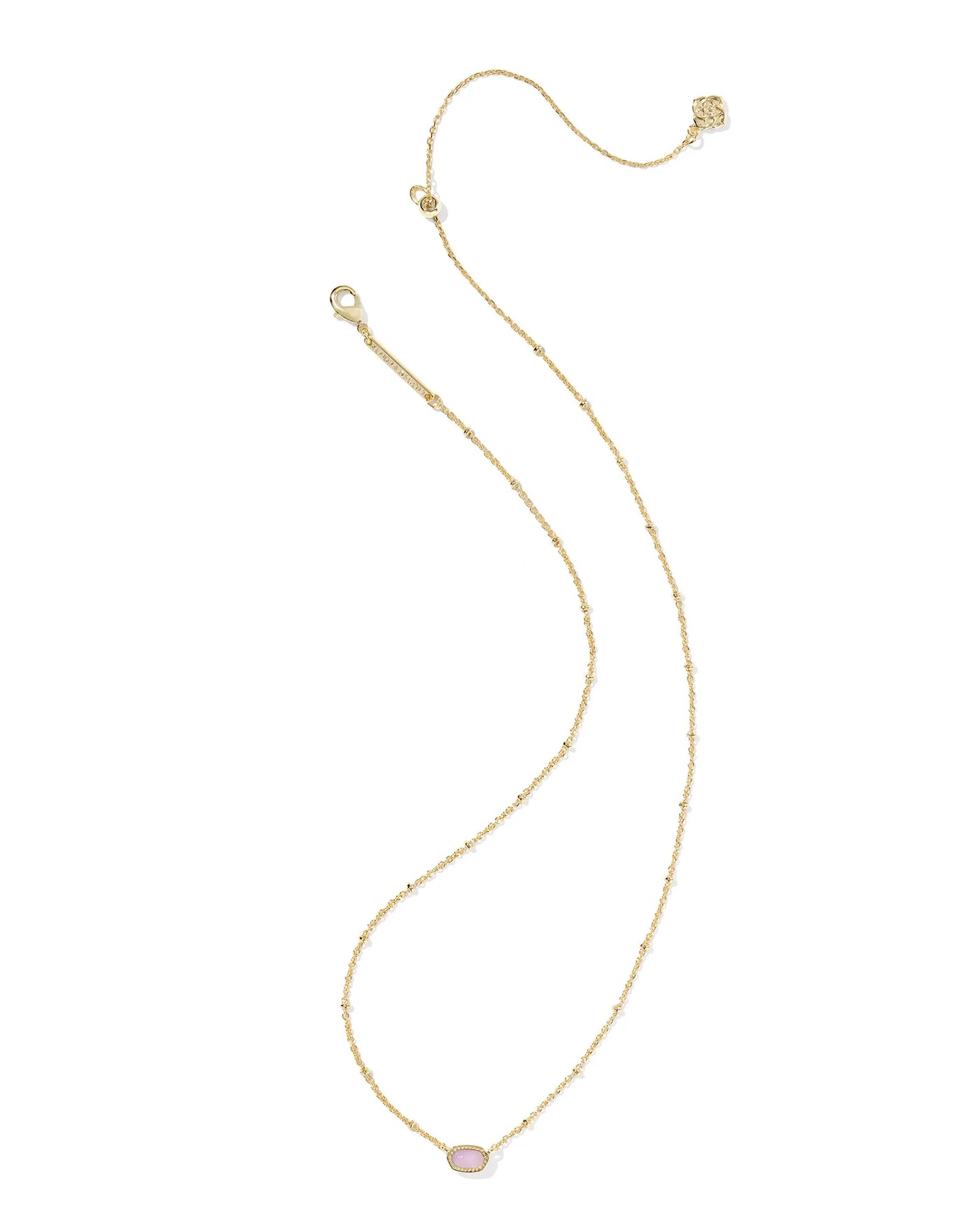 Gold necklace with a small purple pendant on a white background.