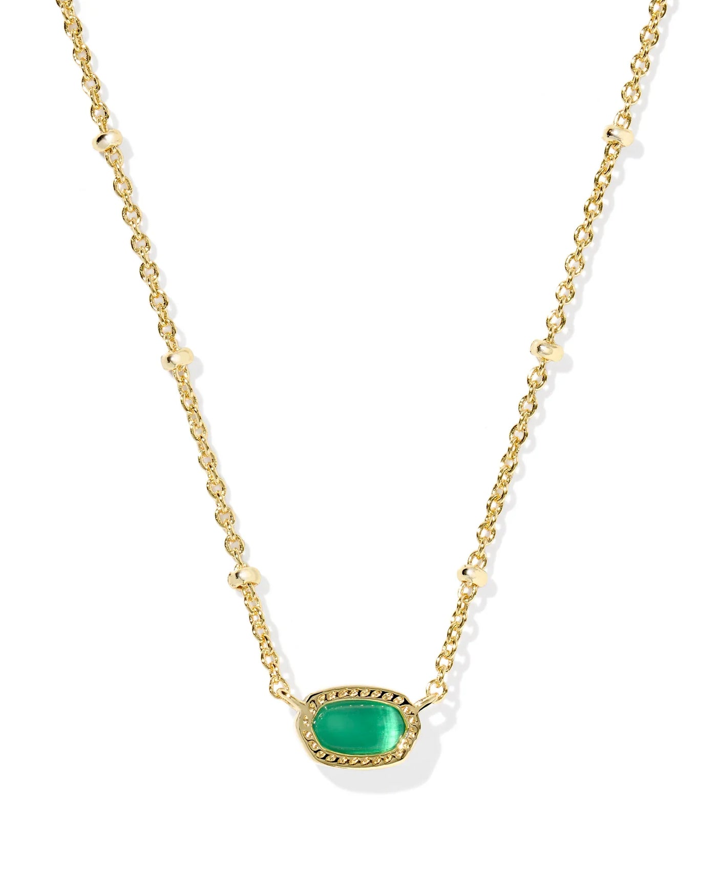 Gold necklace with a green pendant on a white background